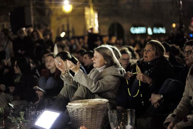 A prayer vigil outside the Notre-Dame cathedral following this week's devastating fire.