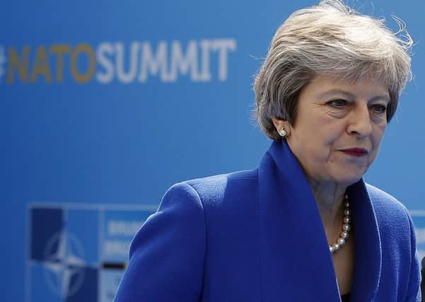Theresa May at a Nato summit.