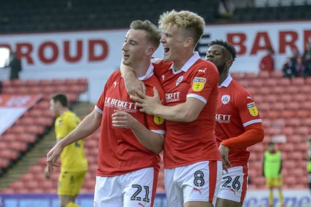 On track: Mike Bahre celebrates his opening goal with Cameron McGeehan before Barnsley progress to a 4-2 win over Fleetwood Town. Picture: Scott Merrylees