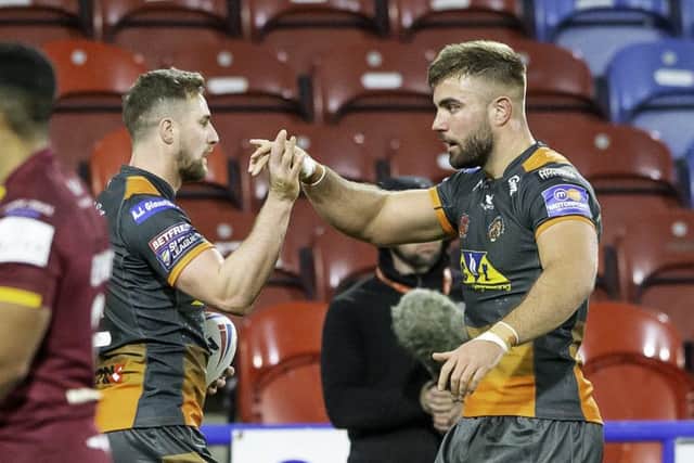 James Clare is congratulated on his try against Huddersfield Giants by Mike McMeeken, right. Picture: Allan McKenzie/SWpix.com