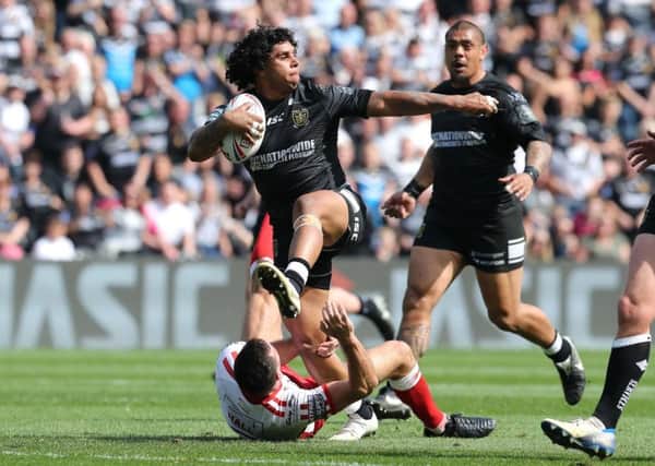 CATCH ME IF YOU CAN: Hull FC's Albert Kelly avoids a tackle from Hull KR's Craig Hall. Picture by Ash Allen/SWpix.com -