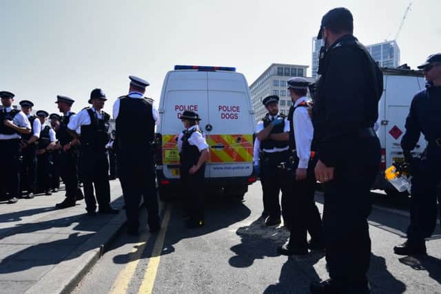Police prepare to remove Extinction Rebellion demonstrators on Waterloo Bridge in London.
