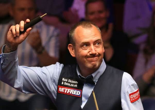 Mark Williams celebrates his victory over Martin Gould at The Crucible. Picture: Nigel French/PA