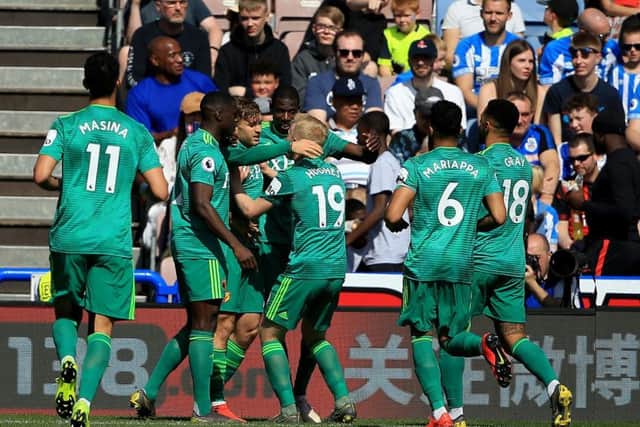 Watford's Gerard Deulofeu (third left) celebrates after he scores at the John Smith's Stadium. Picture: Clint Hughes/PA