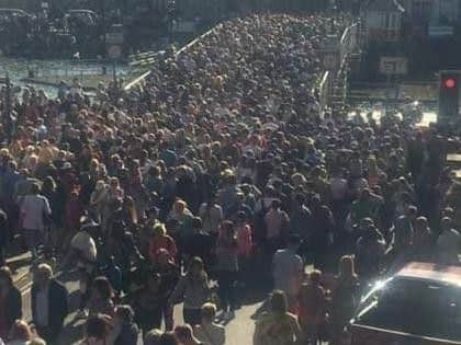 Crowds crossing the Swing Bridge in record-breaking Easter temperatures