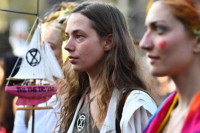 Extinction Rebellion demonstrators listen to 16-year-old Swedish climate activist Greta Thunberg as she addresses the crowd at Marble Arch in London.