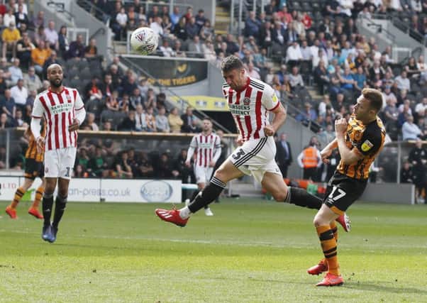 Enda Stevens powers in a bullet header to put Sheffield United three goals to the good against Hull City before half-time (Picture: Simon Bellis/Sportimage).