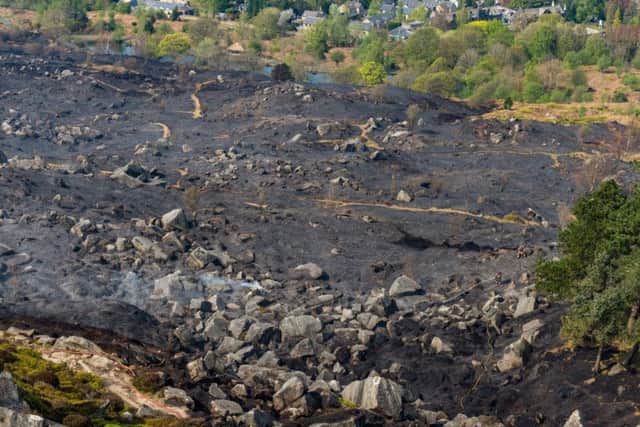 Firefighters continue to damp down following a moorland fire on Ilkley Moor. It came as crews battled a much larger blaze on Marsden Moor - caused by a barbecue.