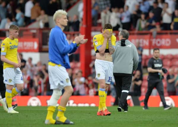 Pablo Hernandez buries his face in his shirt after Leeds United's loss at Brentford (Picture: Bruce Rollinson).