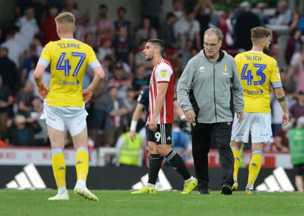 FADING FAST: Leeds United head coach Marcelo Bielsa walks across the pitch after Easter Monday's 2-0 defeat to Brentford at Griffin Park. Picture: Bruce Rollinson
