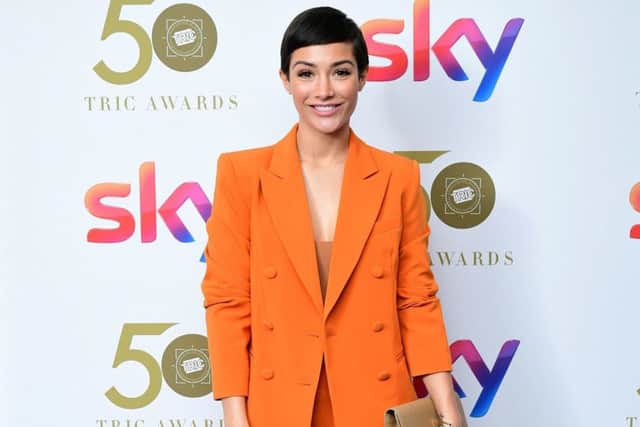 Frankie Bridge in sunset orange ar the TRIC Awards. Picture: Ian West/PA Wire