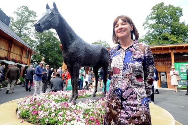 Lady Jane Cecil stands by the statue of Frankel at York Racecourse.