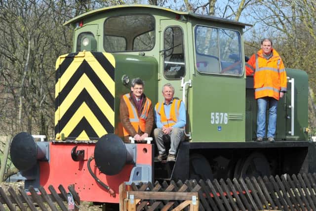 L to r... Volunteer Director  of the Yorkshire Wold Railway Phil Robson,  volunteer John Lidster (corr) and    Martyn Jones  The Volunteer Operations Director on  board    'Sir Tatton Sykes' an Industrial Diesel Engine on the Yorkshire Wolds Railway near Fimber.