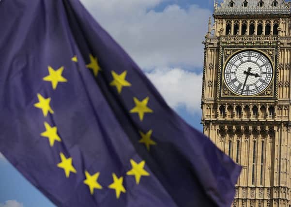 A European Union flag in front of Big Ben, as Remain supporters demonstrate in Parliament Square, London, to show their support for the EU in the wake of Brexit.