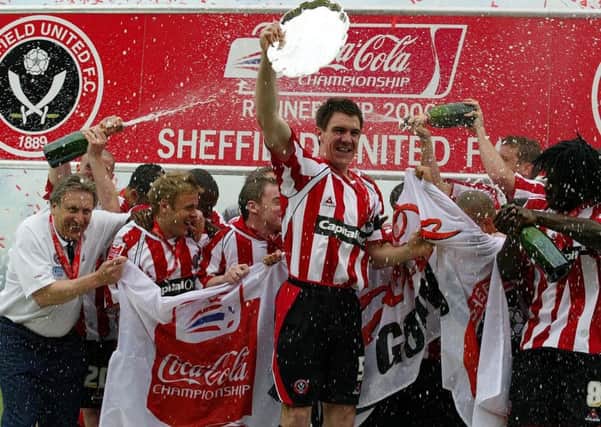 Glory day: Sheffield United's Chris Morgan celebrates with the Championship runners-up plate after the Coca-Cola Championship match against Crystal Palace at Bramall Lane in 2006.