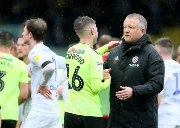 Sheffield United manager Chris Wilder talks to Oliver Norwood after last month's win over Leeds United at Elland Road (Picture: Richard Sellers/PA Wire).