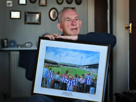 Former Huddersfield Town club secretary George Binns with a painting of the last match to be played at Leeds Road against Blackpool on April 30, 1994. Picture: Jonathan Gawthorpe