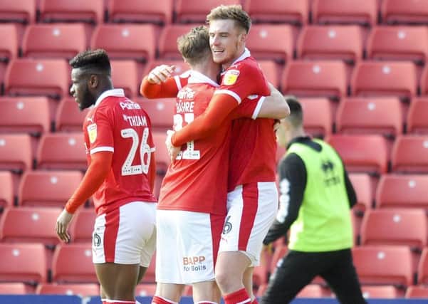 Barnsley's Liam Lindsey is congratulated after scoring the winner at Oakwell. Picture: Dean Atkins