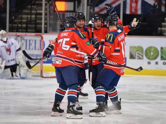 GB's players celebrate Mark Richardson's first-minute opener against Topredo at Sheffield Arena. Picture: Dean Woolley.