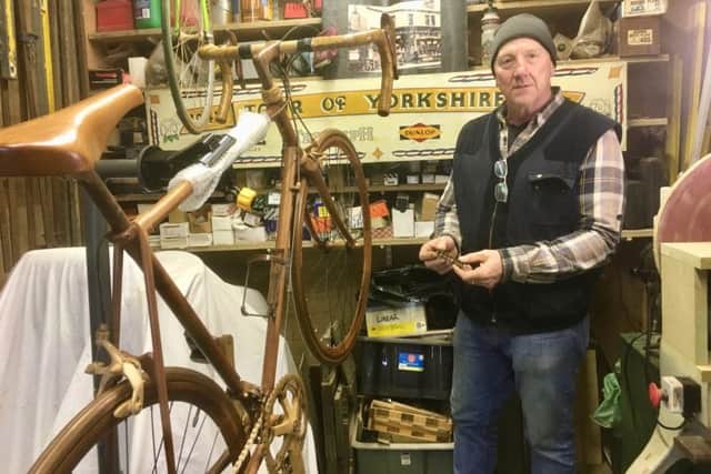 Richard Uttley working on the wooden bicycle in his shed