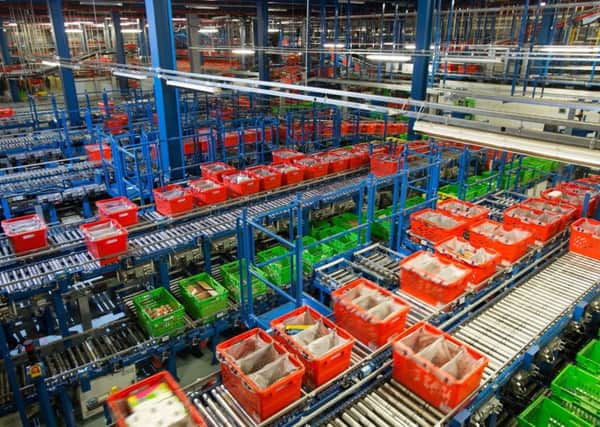 File photo dated 21/12/15 of Ocado's Customer Fulfilment Centre in Hatfield, as the online grocer confirmed the sector's fierce price war is beginning to ease off as the Brexit-hit pound starts to push up prices. PRESS ASSOCIATION Photo. Issue date: Tuesday March 14, 2017. Chief executive Tim Steiner, said the group was seeing the "first signs of a change in market pricing" after years of food price deflation sparked off by competition from German discounters Aldi and Lidl. See PA story CITY Ocado. Photo credit should read: Daniel Leal-Olivas/PA Wire