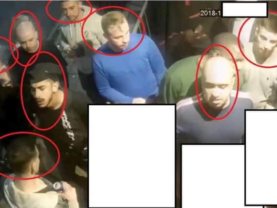 Police want to speak to these men after metal barriers were thrown at club bouncers in Doncaster.