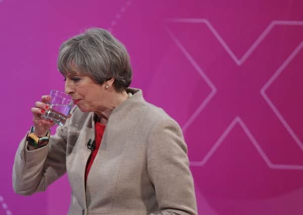 Theresa May takes a sip of water during the 2017 election when she was questioned by voters in York.