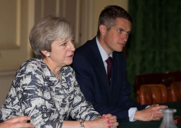 Theresa May with Gavin Williamson who she sacked as Defence Secretary this week.