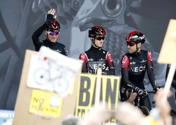 Chris Froome waves to the crowds at the start of the Tour de Yorkshire where fracking demonstrators protested at the presence of Team Ineos.