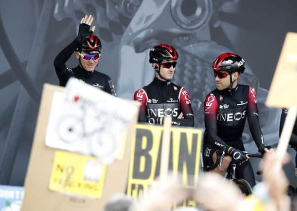 Chris Froome waves to the crowds at the start of the Tour de Yorkshire where fracking demonstrators protested at the presence of Team Ineos.