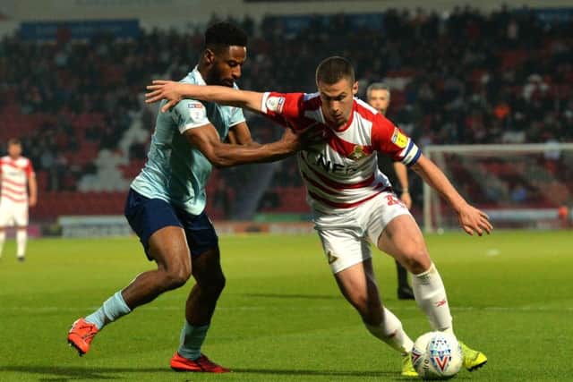 On the ball: Tommy Rowe, in action against Accrington Stanley, aims to drive Doncaster into play-offs.  (Picture: Bruce Rollinson)