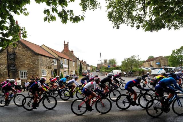 The women's race rides through West Tanfield during the 2019 Tour de Yorkshire.