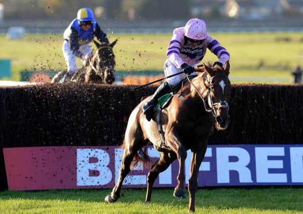 Ruby Walsh and Silviniaco Conti clear the last in the 2012 Charlie Hall Chase at Wetherby.