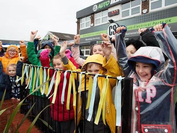 Children from St Josephs school, Castleford celebrate the arrival of the Tour de Yorkshire