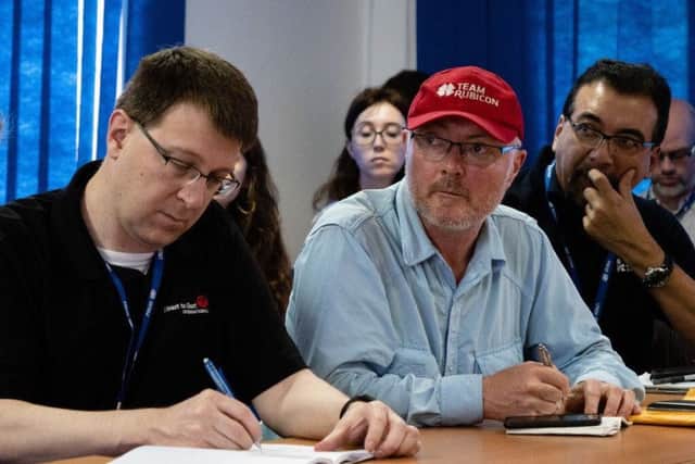 Tim Brear (right) played a vital role in Team Rubicon's efforts to help victims of Cyclone Idai.