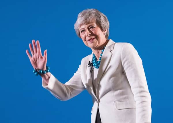 Theresa May was heckled as she addressed Tories in Wales after the local elections.