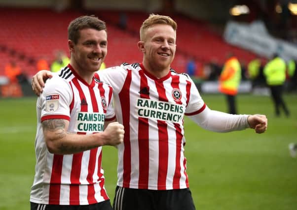 Sheffield United's John Fleck (left) and Mark Duffy celebrate promotion.
