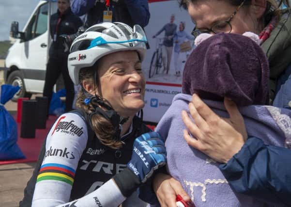 Baby came too: Lizzie Deignan cuddles daughter Orla after completing the womens race in Scarborough. (Picture: Bruce Rollinson)