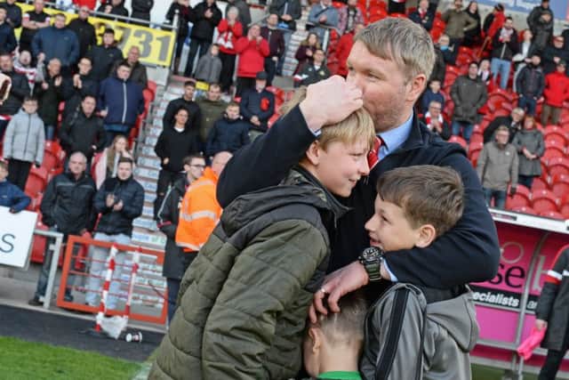 Into the play-offs: Grant McCann celebrates with his family.