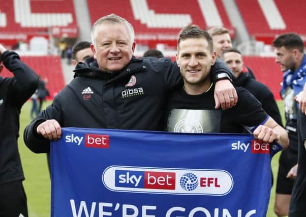 Chris Wilder, manager of Sheffield United, with captain Billy Sharp after their 2-2 draw at Stoke City on the final day of the season (Picture: Simon Bellis/Sportimage).