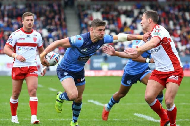 St Helens' Tommy Makinson takes on Hull KR. (SWPix)