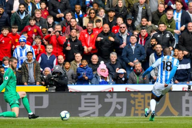 Huddersfield Town's Isaac Mbenza threads the ball between David de Gea's legs to equalise against Manchester United (Picture: Anthony Devlin/PA Wire).