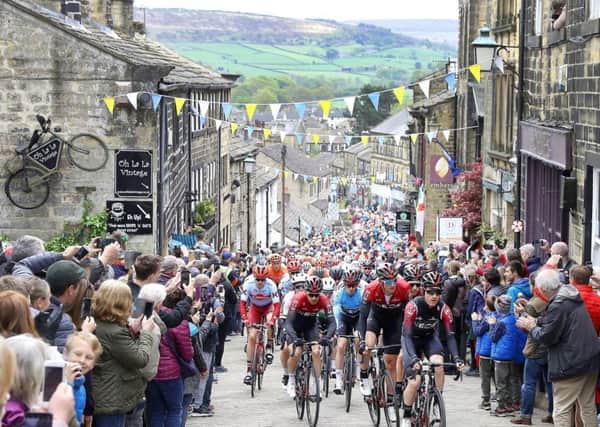 Team INEOS lead the peloton including leader Chris Lawless as they climb a hill in Haworth, during stage four of the Tour de Yorkshire. PRESS ASSOCIATION Photo. Picture date: Sunday May 5, 2019.  See PA story CYCLING Tour de Yorkshire. Photo credit should read: Martin Rickett/PA Wire