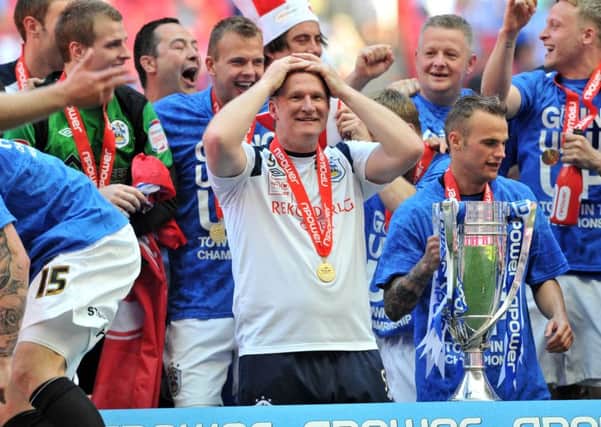 Simon Grayson celebrates winning promotion to the Championship with Huddersfield Town in 2012 (Picture: Bruce Rollinson)