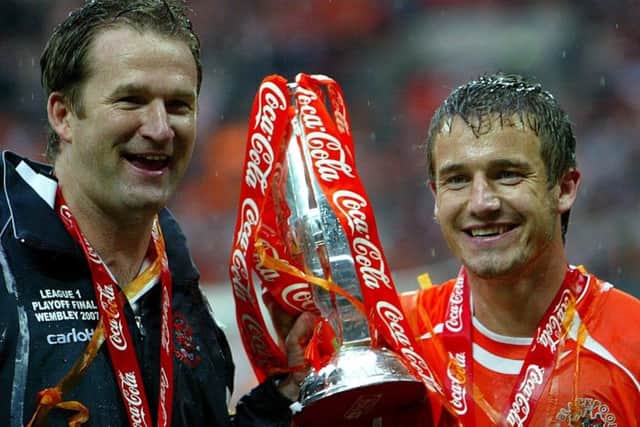 Blackpool's manager Simon Grayson (left) and Kiegan Parker celebrate with the Play Off Final trophy after winning the Coca-Cola Football League One Play-Off Final at Wembley Stadium, in 2007 (Picture: PA)