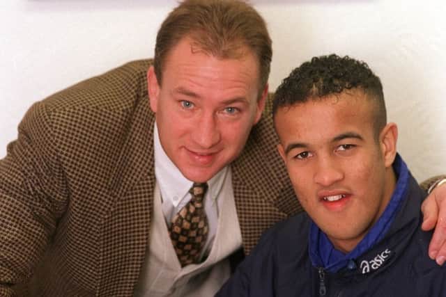 Jamie Jones-Buchanan  signs for Leeds R.L in 1997. Pictured with coach Dean Bell (PIcture: Steve Riding)