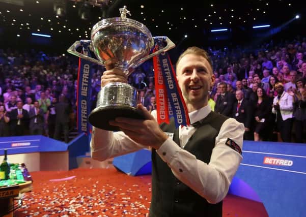 Judd Trump celebrates with the trophy after winning the 2019 Betfred World Championship at the Crucible, Sheffield (Picture: Richard Sellers/PA Wire).