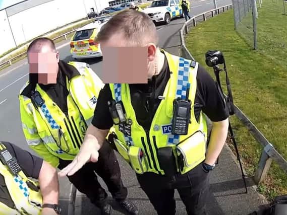 A photographer was arrested by police under the Terrorism Act for filming outside a police station in Normanton.