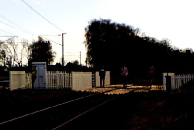 Young people loiteringon the Castle Hills level crossing in Northallerton.