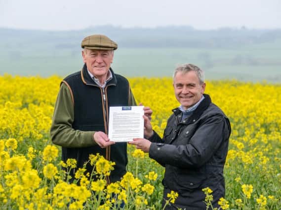 David Kerfoot, chairman of the North Yorkshire and East Riding LEP hands over the open letter, which has been written by the LEPs new initiative, Grow Yorkshire, on behalf of farming and rural communities, to Farming Minister Robert Goodwill. Picture by Scott Merrylees.